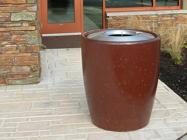 Large concrete trash cans and cement waste receptacles.